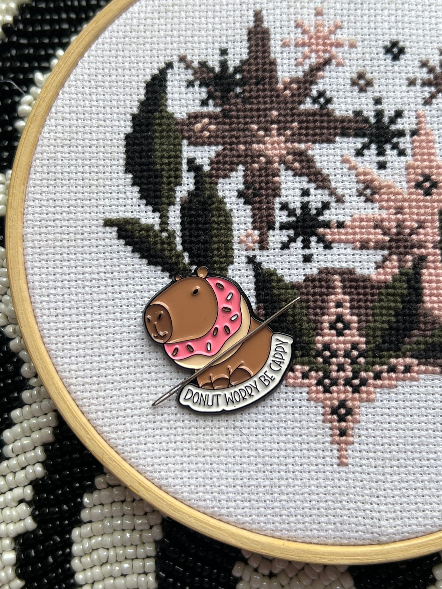 Donut worry, be cappy needle minder