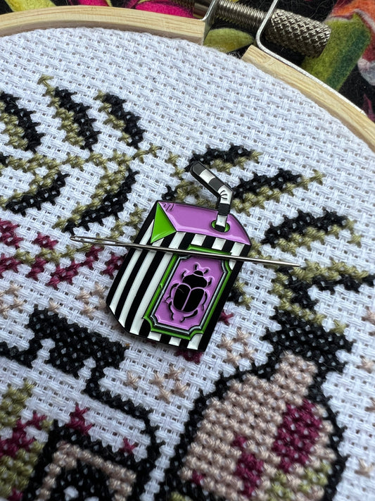Beetlejuice magnetic needle minder