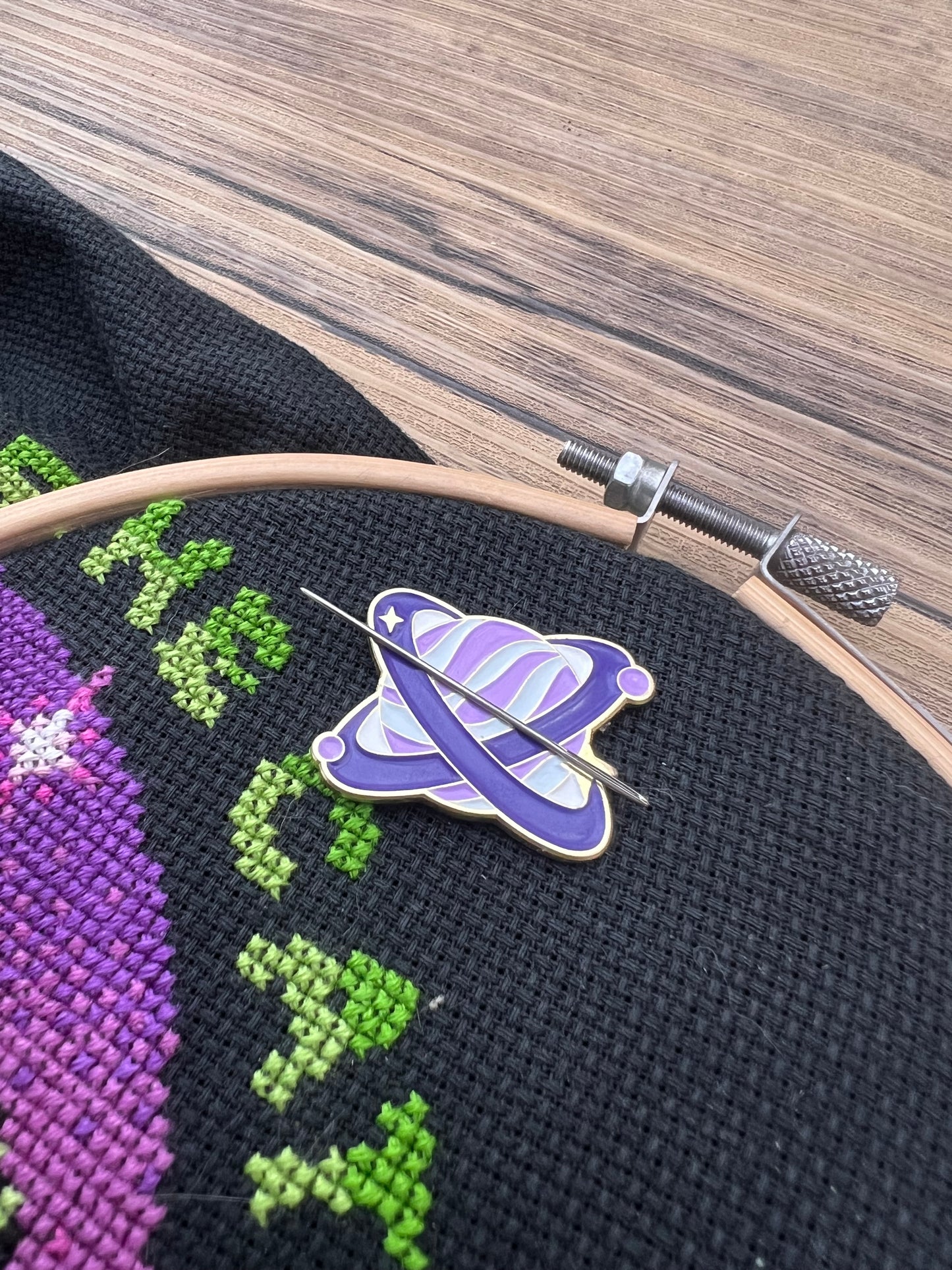 Purple planet magnetic needle minder