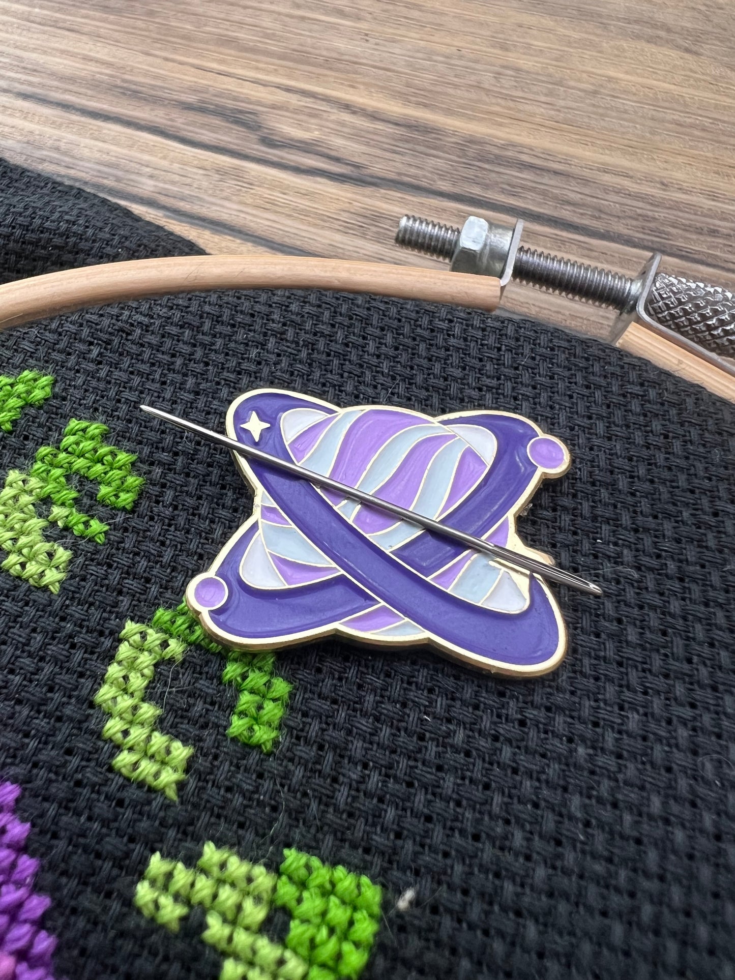 Purple planet magnetic needle minder