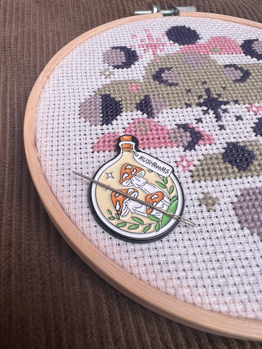 Orange potion magnetic needle minder